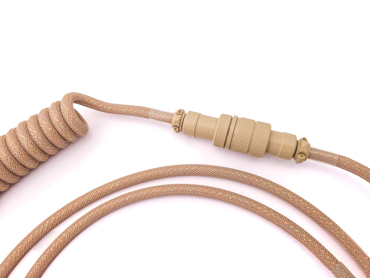 Beige Aviation Gx16 connector on coiled cable in beige Galaxy theme