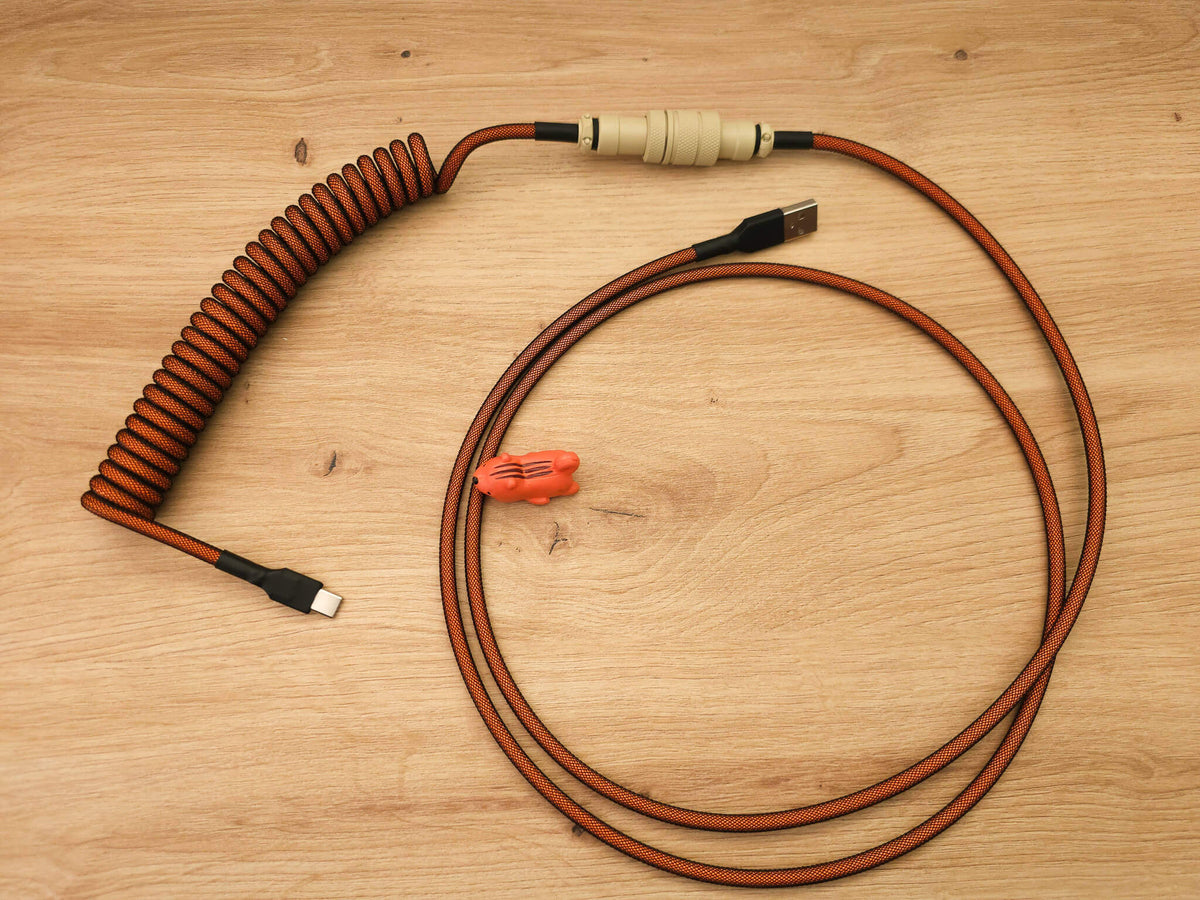 Coiled keyboard cable for Carbon keycaps  with orange coil, beige Gx16 and black heat shrink