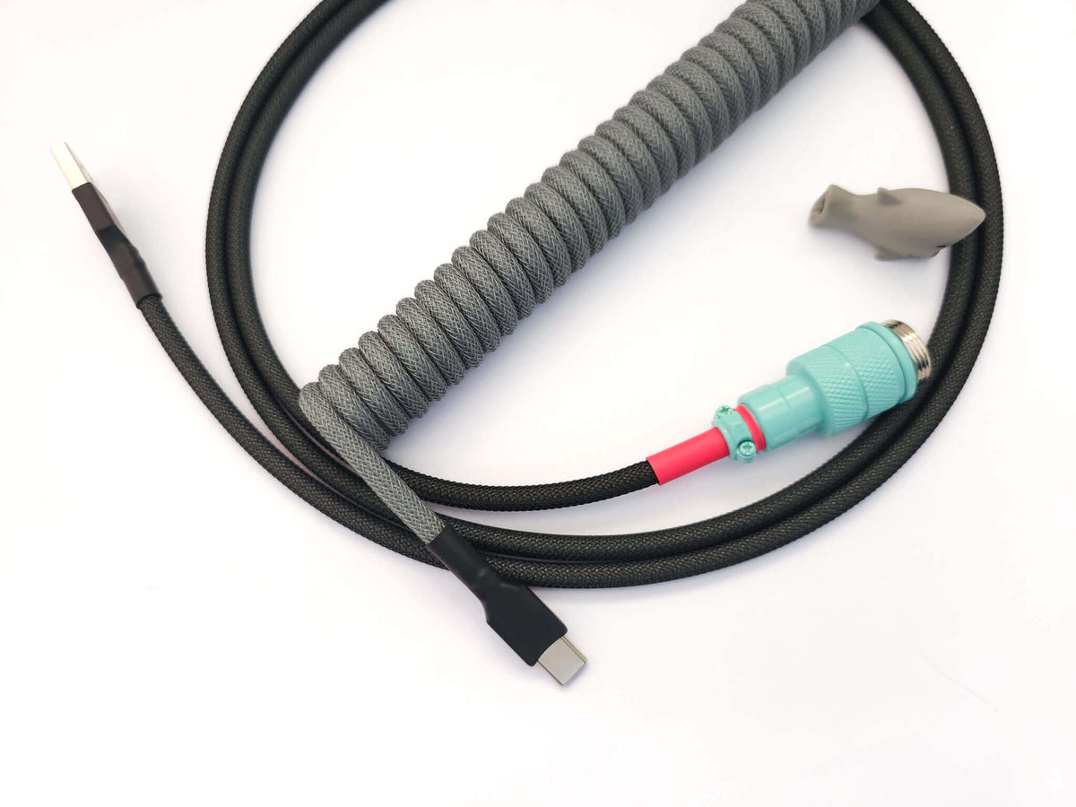 Coiled cable for GMK Modern Dolch Keycaps. With Gx16 Aviator and black heat-shrink and USB C to C connection.