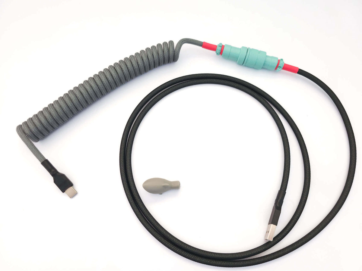 GMK Modern Dolch matching coiled USB cable with teal Gx16 and black and red heat shrink.