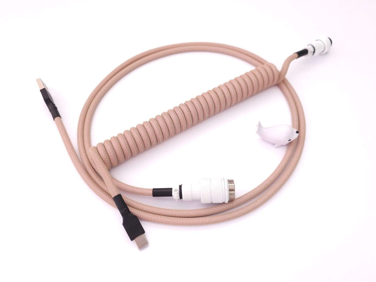 Coiled keyboard cable designed for GMK Olivia keycaps with white Aviator connector and black heat shrink