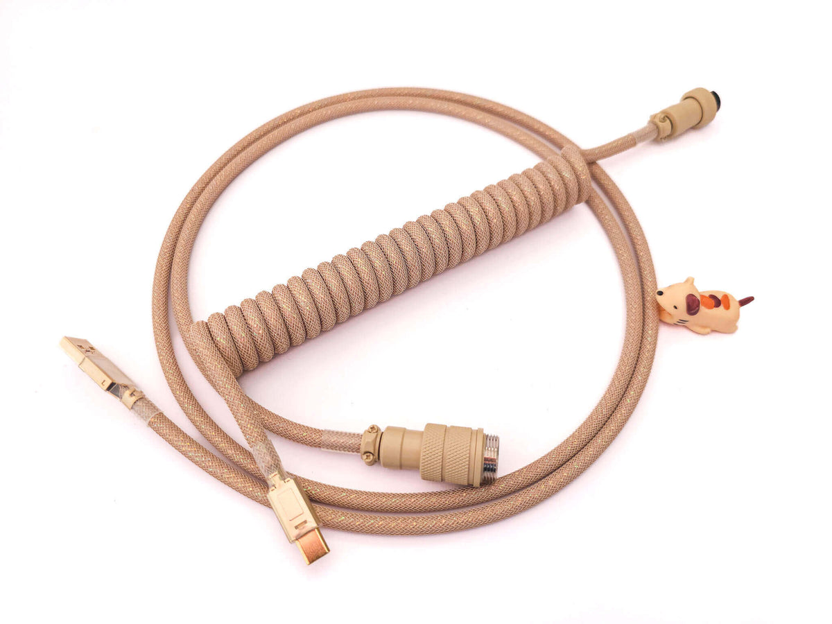 Beige Galaxy coiled cable with beige Gx16 aviator and golden USB C connectors