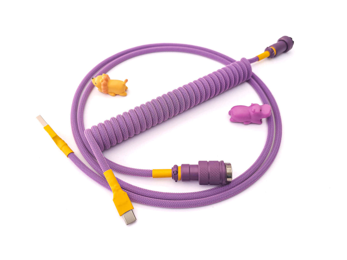 Coiled keyboard cable designed for Octopus PBT keycaps with purple coil, purple Gx16 and yellow heat shrink