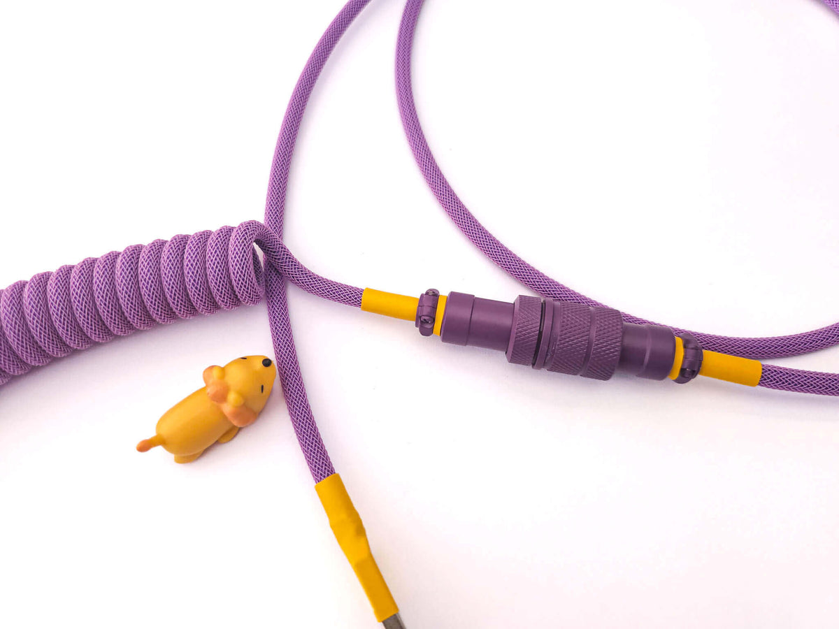 Purple USB C keyboard cable for Octopus keycaps with yellow heat shrink