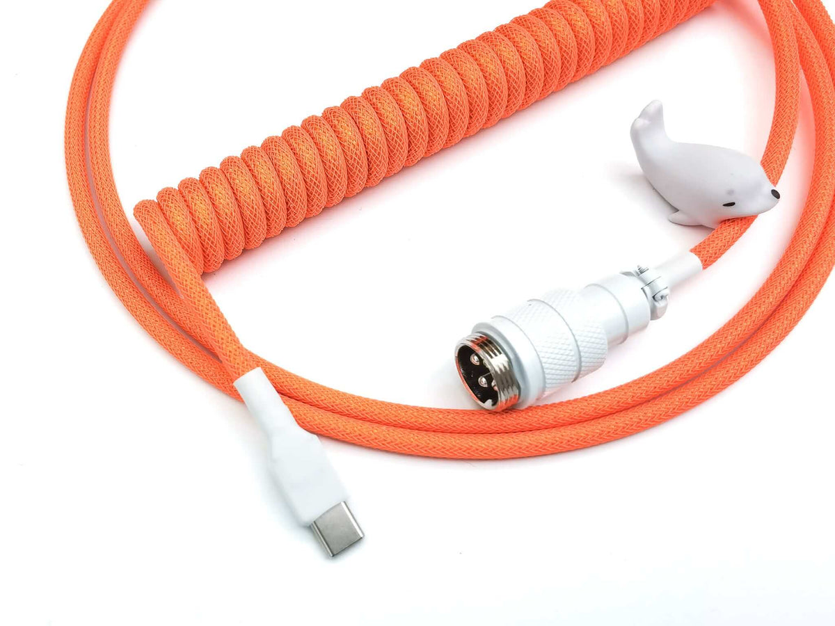 Neon orange custom coiled cable with USB C to C, white heat-shrjnk and Aviator connector
